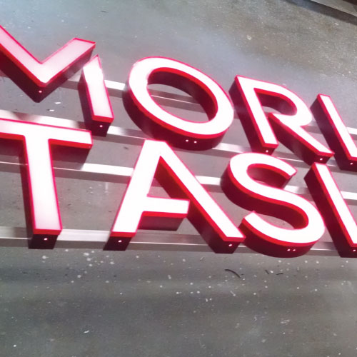 Tower Crane Signs made by Dee Sign. We fabricate framing behind lightweight channel letters creating a strong sign for mounting on cranes. Low voltage LED with a photo cell for automatic on and off.
